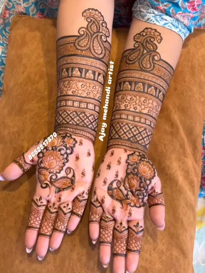 A lovely floral and paisley design for a bride, with delicate peacocks on the palms and elegant patterns on the arms.