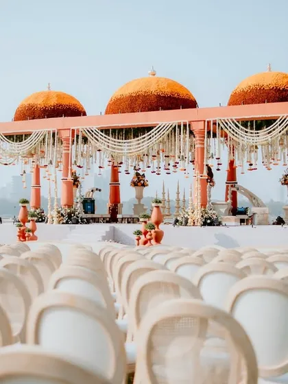I love creating mandaps that honor timeless traditions while making a grand statement. For this ceremony, I designed magnificent marigold domes set against the city skyline, blending cultural richness with modern luxury for a truly regal wedding.