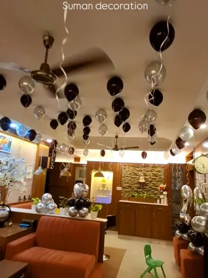 A wide shot showing how the balloon decoration extends throughout the open-plan living and dining area.