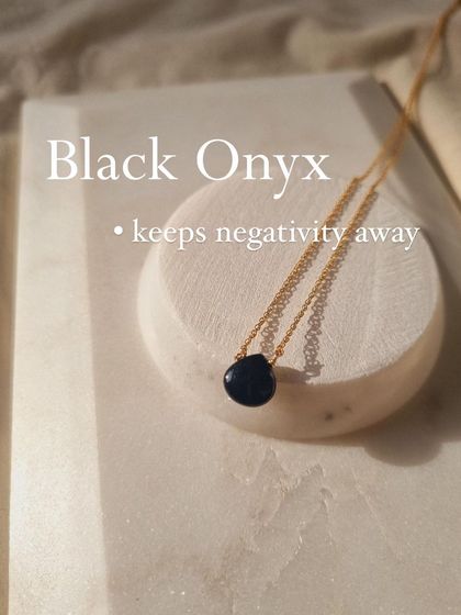 Another view of the Black Onyx heart drop pendant, a simple and elegant way to keep negativity at bay.