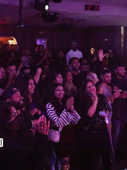 The crowd cheering on a performer at Bollywood Disco. There's so much love and support in the room at these events.