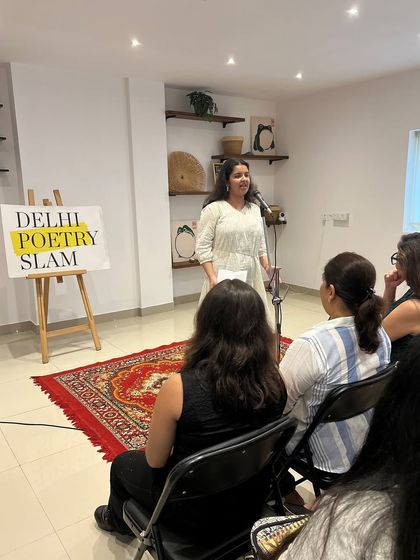 A poet sharing her truth on stage. Our open mics are a platform for diverse voices and stories that need to be told.