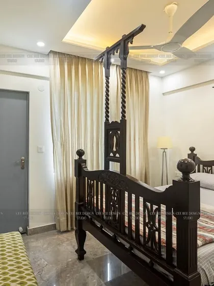 A full view of the heritage bed from image 192, with a Buddha painting on the wall.
