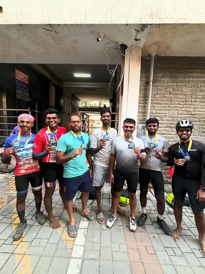 A group of finishers celebrates with their medals after the Jog Falls 1000K BRM. The shared sense of accomplishment is a powerful bond.