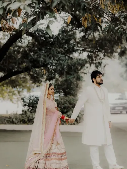 A simple walk, hand in hand, becomes a profound moment. Shreya and Rahul at Mallu Farms, stepping into their future together, framed by nature.