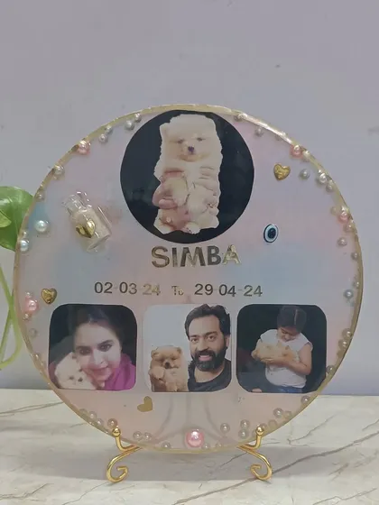 Our furry friends are family, and their memories are just as precious. For this client, I created a memorial frame for her beloved puppy, Simba, preserving his hair in a tiny bottle along with his photos.