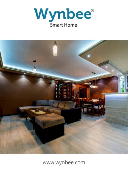 This living room and kitchen are full of life, thanks to integrated LED light strips. The strips feature both warm and brilliant white lights that can be operated independently, dimmed, and controlled from anywhere.