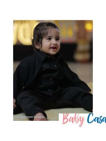 Dressed in all black for a Lohri night. This little boy looks sharp and stylish in his custom black kurta set, ready for the bonfire celebration.