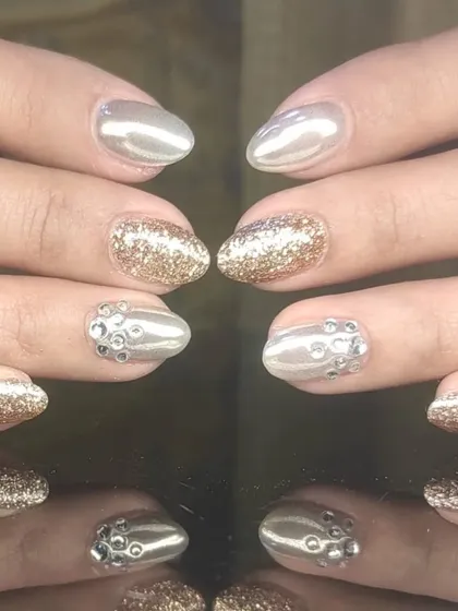 Another view of the mixed-metal and glitter manicure, perfect for a party.