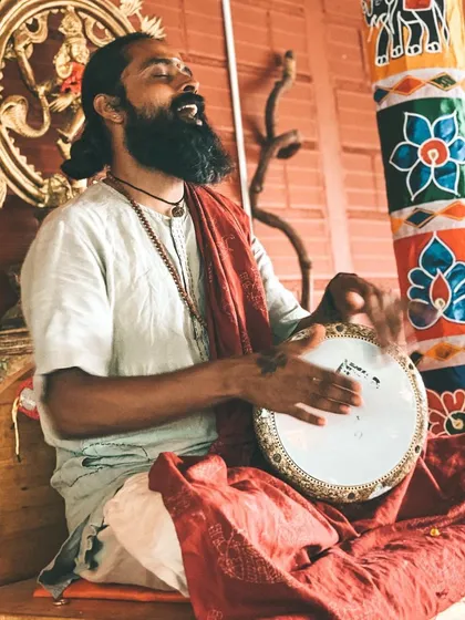 I find joy in music and chanting, playing a drum during a kirtan session. Music is a powerful way we connect to the divine and to each other.