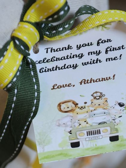 The personalized tag is the perfect finishing touch on this jungle-themed tote bag favor.