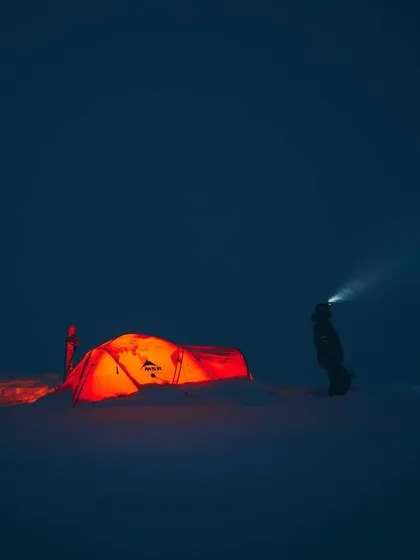 In the deep of a snowy night, a headlamp cuts through the darkness, revealing the glowing tent. When visibility is low, the tent becomes a sanctuary of warmth and safety.