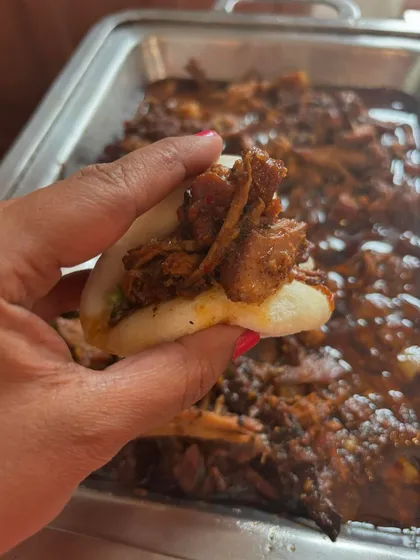 A soft, fluffy bao bun generously stuffed with my signature pulled pork. It's a wonderful snack or appetiser, especially when paired with a refreshing drink.