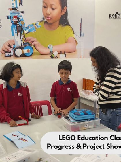 A parent looks on as two students from Vidyashilp Academy proudly present their LEGO project. Our after-school programs encourage students to articulate what they have built and learned.