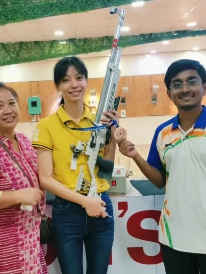 Ankita celebrating her bronze medal win with her family and coach Dhananjay Nagpure. Support from family is a huge part of a young athlete's success.