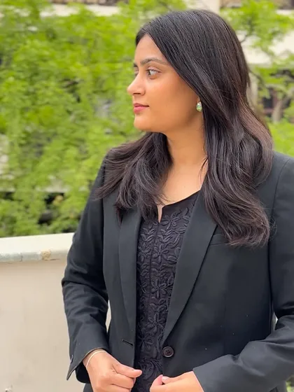 A profile shot showing a different angle. As a "Lady Lawyer," I embrace both my femininity and my fierce professional identity.