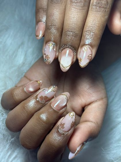 The complete look of this stunning bridal manicure. The combination of hand-painted art and the cat eye effect creates a design that is both traditional and modern.