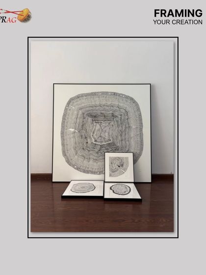 A collection of framed charcoal drawings, ready for a gallery wall. The consistent use of sleek black metal frames with precision-cut white mounts creates a modern, cohesive, and gallery-worthy display.