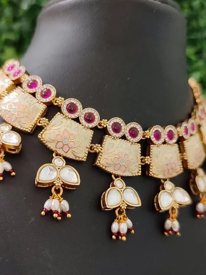 A close-up of the necklace, highlighting the unique design and color combination.