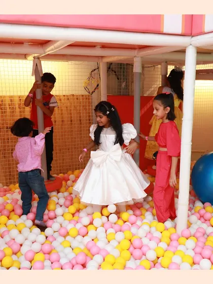 A princess in her castle of balls. The ball pit is a great place for imaginative play and making new friends.