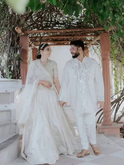 An elegant daytime portrait capturing a quiet moment of togetherness. We masterfully use natural light to create soft, romantic, and airy frames that highlight the couple's serene bond and exquisite attire.