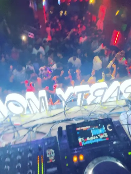 A view from above the decks at Blurred X Party Monkeyz. You can feel the energy radiating from the packed dance floor.
