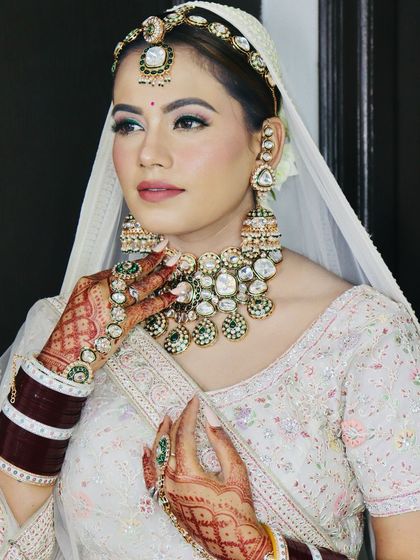 A confident look from the bride, her makeup perfectly enhancing her features.