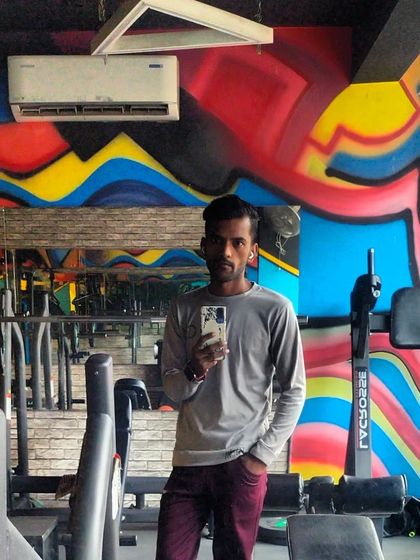 A selfie at The Fit Zone gym. The graffiti wall adds to the high-energy vibe of the space.