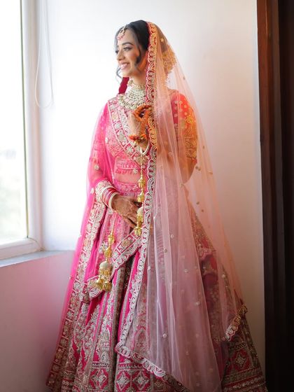 Shivangi looked absolutely radiant for her day wedding. I created a minimal makeup look that embraced her natural glow and paired it with her beautiful pink lehenga.