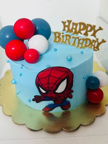A cute and simple half-kilogram Spider-Man cake, perfect for a smaller celebration.