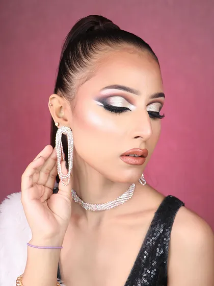 A creative and dramatic fashion makeup look with a sharp graphic eyeliner. This is the kind of advanced, artistic makeup we teach for portfolio and runway work.