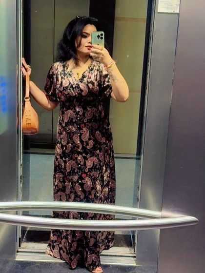 An elevator selfie capturing the full effect of the comfortable and chic maxi dress.
