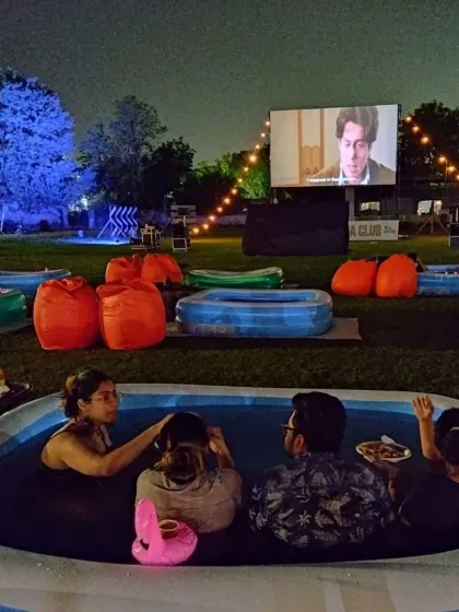 Our Bathtub Cinema setup, where groups of friends can share a larger inflatable tub, complete with snacks and drinks, for a fun and social movie-watching party.