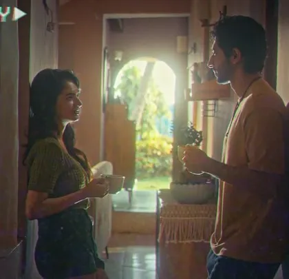 A morning coffee scene from the Valentine's Day film. The casual, everyday wardrobe helps to build the characters and make their story feel relatable to the audience.