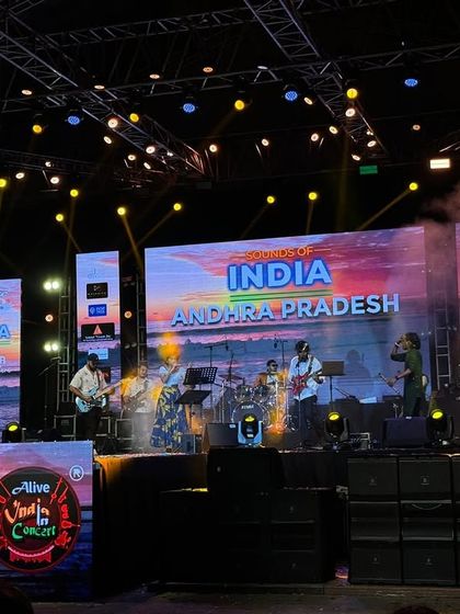 The 'Alive India in Concert' series celebrating Indian music. This stage setup features multiple LED screens and a full band, showcasing our ability to handle multi-media productions.