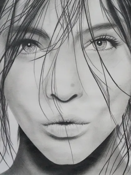 An example of the incredible detail and realism achieved in our pencil portrait classes. We teach shading, texture, and proportion techniques to help you bring your drawings to life.