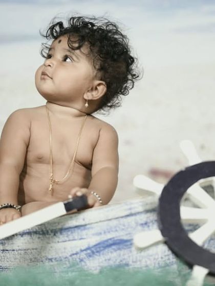 Explore our full nautical and beach-themed collection. These images showcase the variety of poses and angles possible with our boat prop, sand-colored flooring, and ocean backdrop.