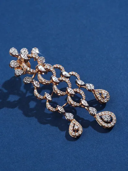 A close-up of the diamond earrings from the Ranka Jewellers set. The lighting is precisely controlled to make every single diamond sparkle, showing off the piece's incredible fire.