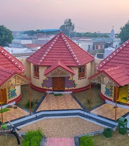 The unique circular huts, or 'bhungas', of a resort in Dholavira, Gujarat. This aerial shot captures the traditional architecture of the Rann of Kutch region.
