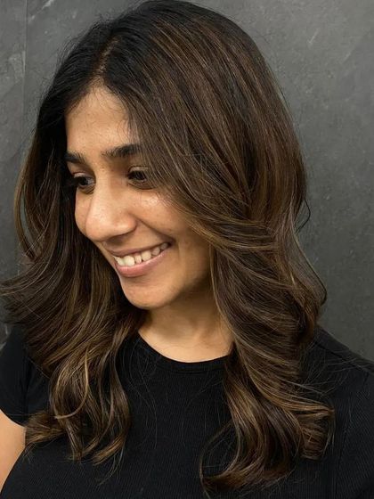 A happy client showing off her new look, her smile says it all.