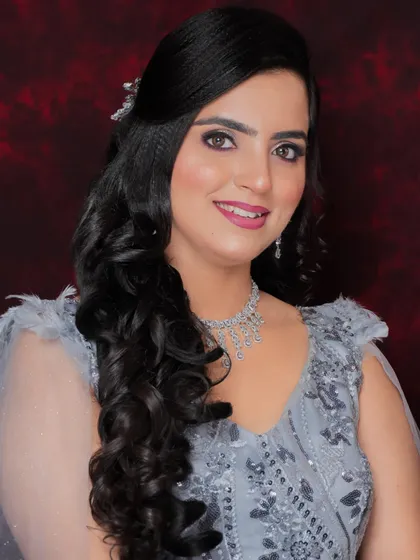 This client looks beautiful and confident in her grey gown. The makeup is soft and elegant, perfect for a sophisticated evening event.