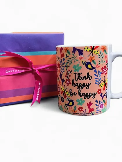 'Think happy, be happy'. A cheerful mug with a simple message, surrounded by birds and butterflies. It comes beautifully gift-wrapped, ready to brighten someone's day.