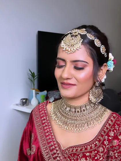 A close-up of a traditional Phera look. I focused on creating a beautiful smokey eye with a touch of shimmer, paired with a matte base to ensure the bride looked perfect for her main ceremony.