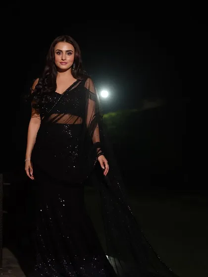 A full-length view showcasing the complete outfit and graceful posture. This type of event portrait is perfect for capturing the style and glamour of your guests.