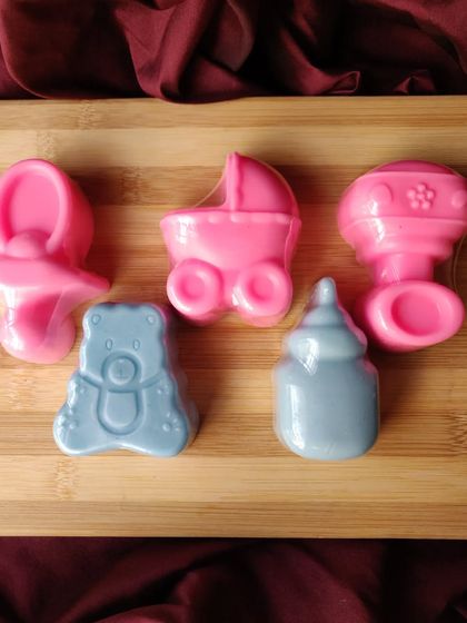 A collection of my different baby-themed soap shapes. You can choose from pacifiers, strollers, rattles, teddy bears, and milk bottles. You can mix and match shapes and colors to create the perfect set for your event.
