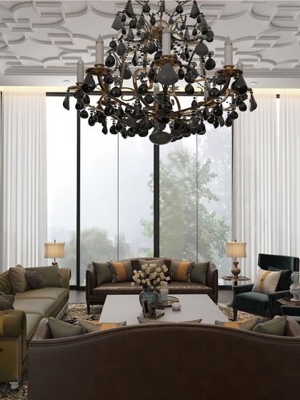 This stunning family lounge proves that a brown color palette can be incredibly sophisticated. The rich, dark tones create a timeless backdrop for elegant furniture, a grand chandelier, and a well-stocked library.