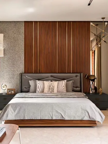 Your bedroom should be your personal sanctuary. For this space, I layered different textures like the wood-paneled accent wall, a soft upholstered headboard, and rich fabrics to create a warm and inviting atmosphere. The goal was to design a room that feels like a true retreat from the hustle of daily life.