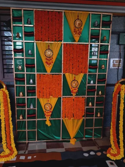 A darker, more atmospheric shot of the Bangle ceremony backdrop, highlighting the colors and textures.