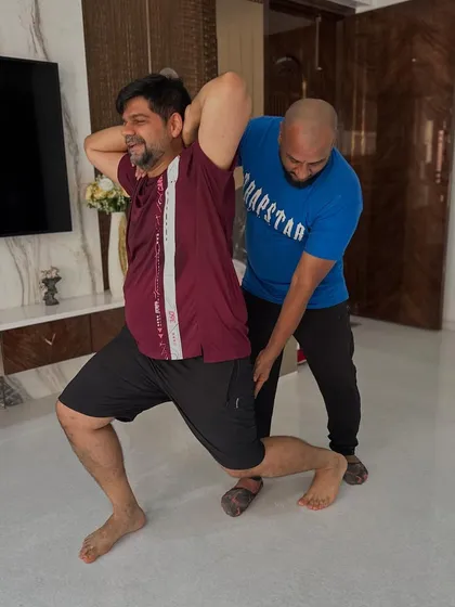 Personal training is all about you. I provide one-on-one guidance to ensure perfect form, prevent injury, and create a customized plan that targets your specific goals, like in this assisted lunge to build leg strength and stability.
