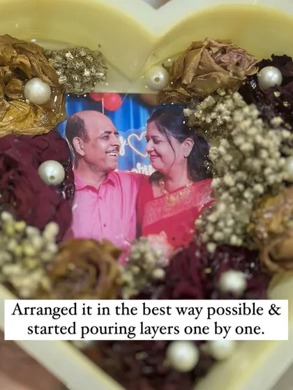 The process of creating the anniversary heart frame. I arranged the flowers carefully around the photo before pouring the resin layer by layer.